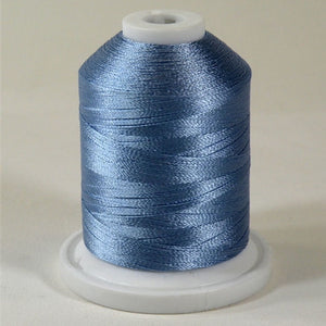 A Sun Blue colored 1100 yd mini king spool of Robison-Anton 40wt Rayon that is vivid, high luster and super-smooth in appearance.