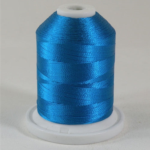 A Pacific Blue colored 1100 yd mini king spool of Robison-Anton 40wt Rayon that is vivid, high luster and super-smooth in appearance.